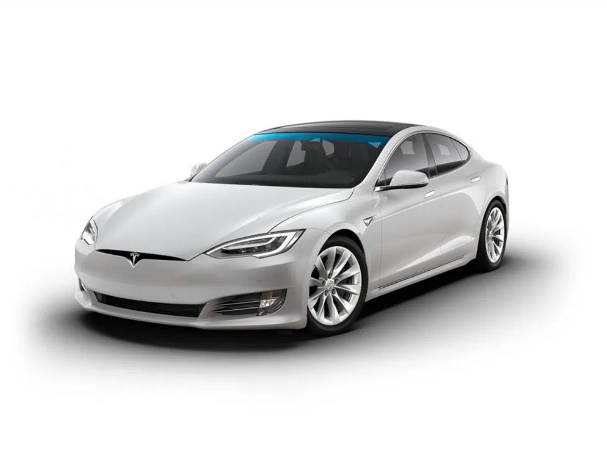 Sleek white electric sedan car with tinted windows and aerodynamic design on a plain background.